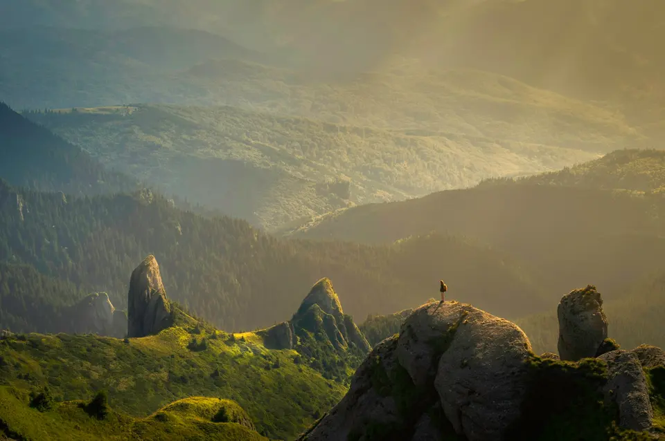 Sunlit mountain ridges receding toward the horizon