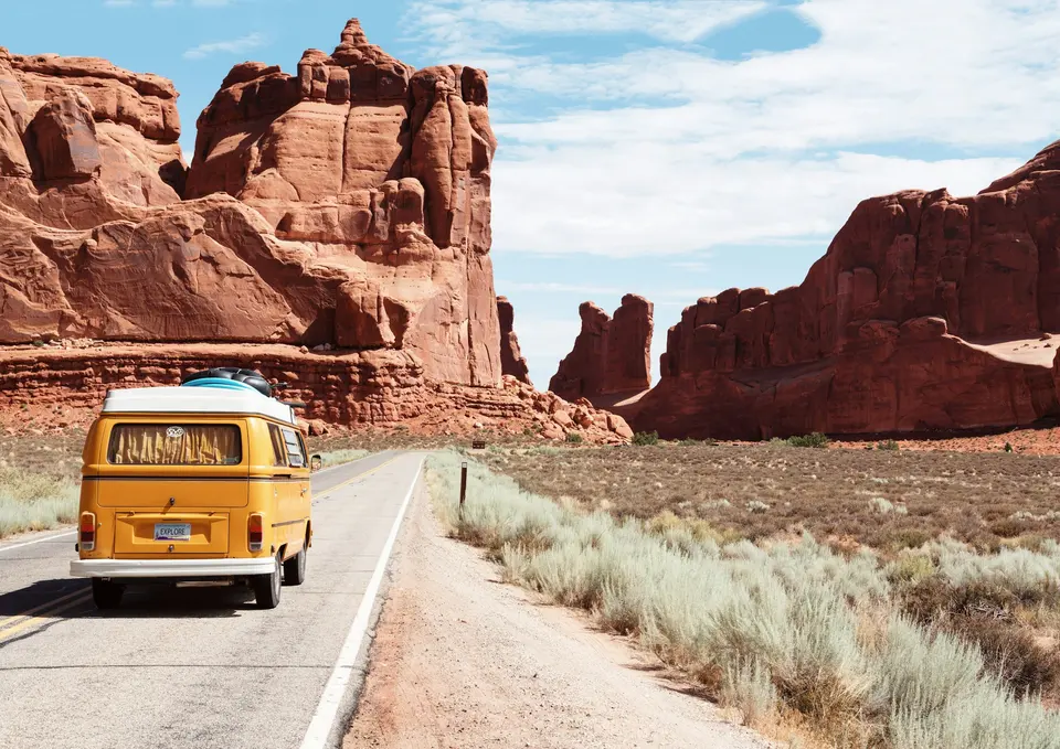 A road journey through an open landscape